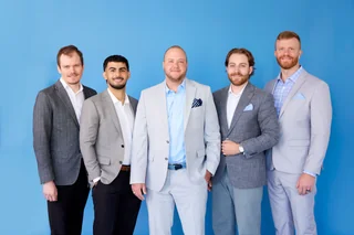 Noulty Financial advisors standing together
